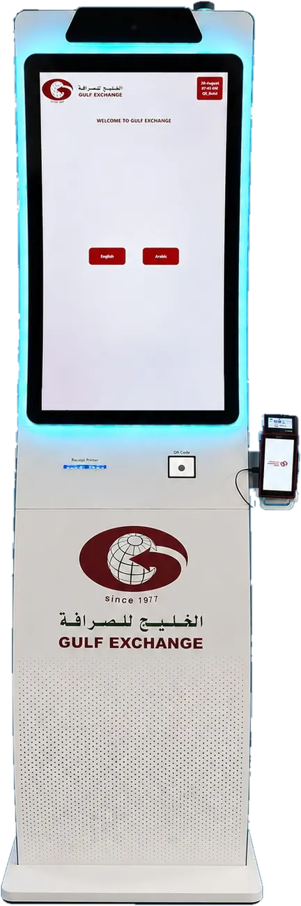 Gulf Exchange self-service kiosk seen from the front, showing the bilingual welcome screen, receipt printer, QR code reader and card payment terminal.